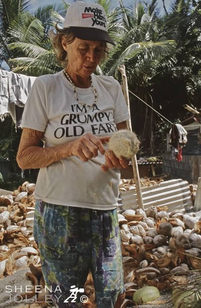 Erlene Downie Coconut Collection.jpg - Erlene Downie's collection of cocnuts which she sells to St. Joseph Nursery for growing orchids. She leaves home early and collects those that have fallen to the ground and hauls them back home mostly from dense undergrowth some way from home